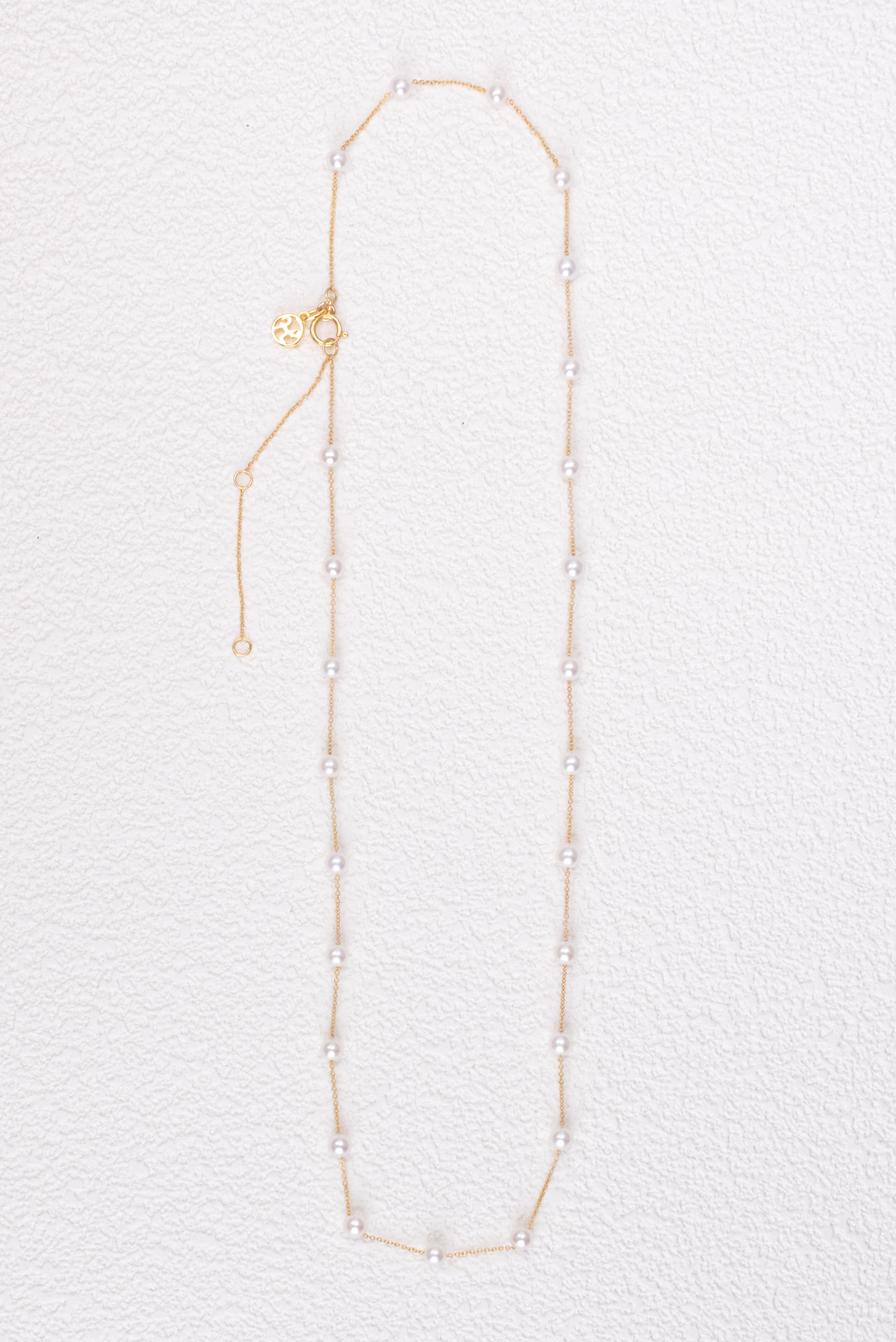 Rhea Pearl Station Necklaces